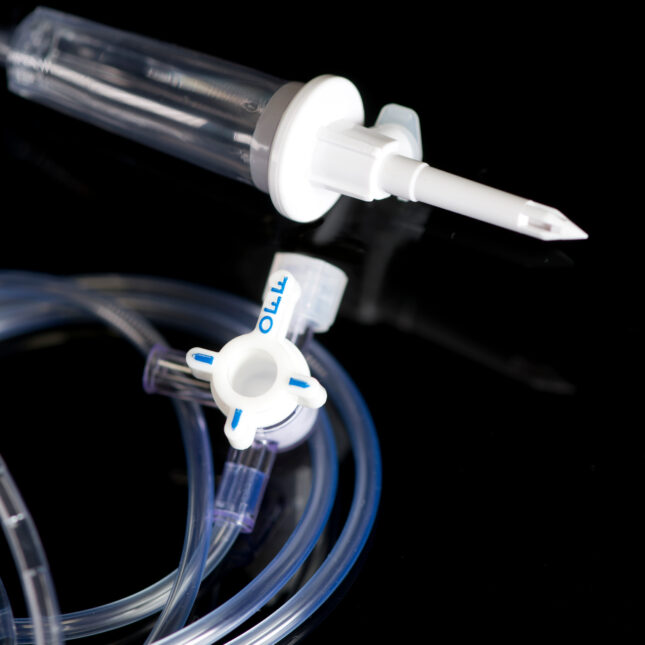 IV drip chamber and IV tubing against a black background. -- first opinion coverage from sTAT