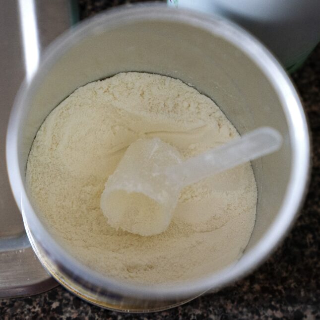 File news photo of an open can of powdered baby formula on a countertop