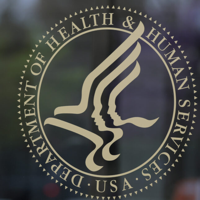 Signage for the Department of Health and Human Services (HHS) headquarters is seen, displayed on a door. -- health policy coverage from STAT