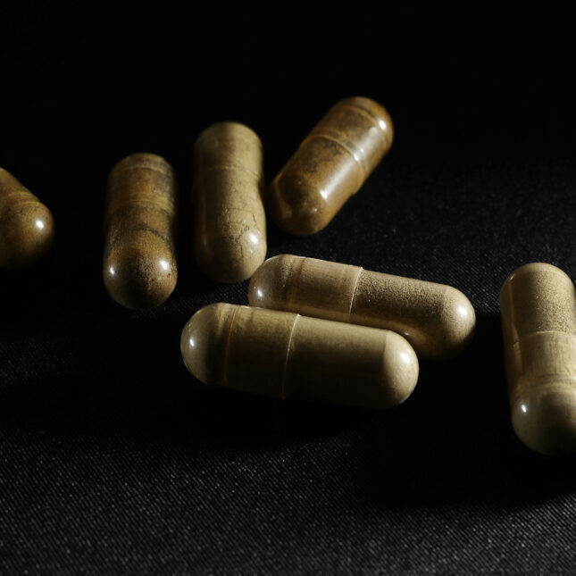 In this photo illustration, capsules of the drug Kratom are seen on May 10, 2016 in Miami, Florida